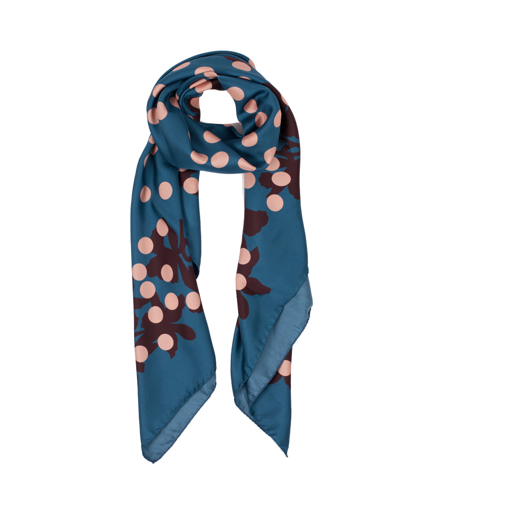 A blue scarf with a pattern of pink polka dots and dark brown floral motifs, displayed on a clean white background.