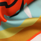 YURI SCARF IN TURQUOISE, WHITE, BLOOD ORANGE AND BLACK